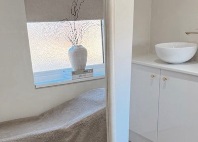 Relaxing treatment room at BySamantha, Stoke-on-Trent, England, GB with a cozy bed and elegant decor.