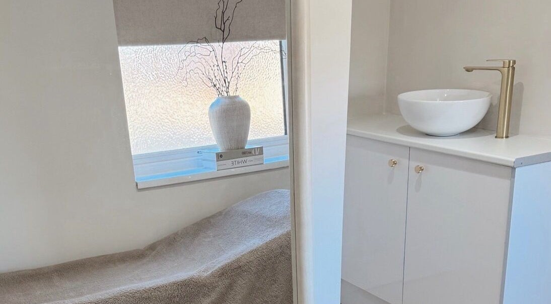 Relaxing treatment room at BySamantha, Stoke-on-Trent, England, GB with a cozy bed and elegant decor.