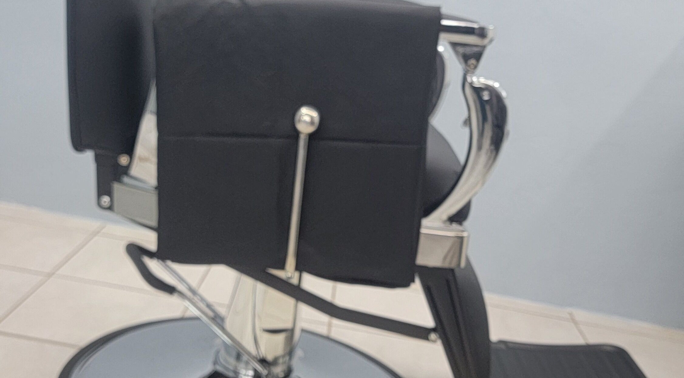 Elegant salon chair at The Alumni, Couva-tabaquite-talparo Regional Corporation, TT, enhancing the client experience.