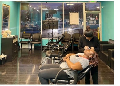 A client receiving a brow service at Brow Art 23, Reisterstown, Maryland, US, in a cozy, well-lit salon.