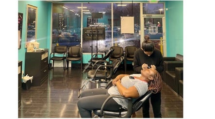 A client receiving a brow service at Brow Art 23, Reisterstown, Maryland, US, in a cozy, well-lit salon.