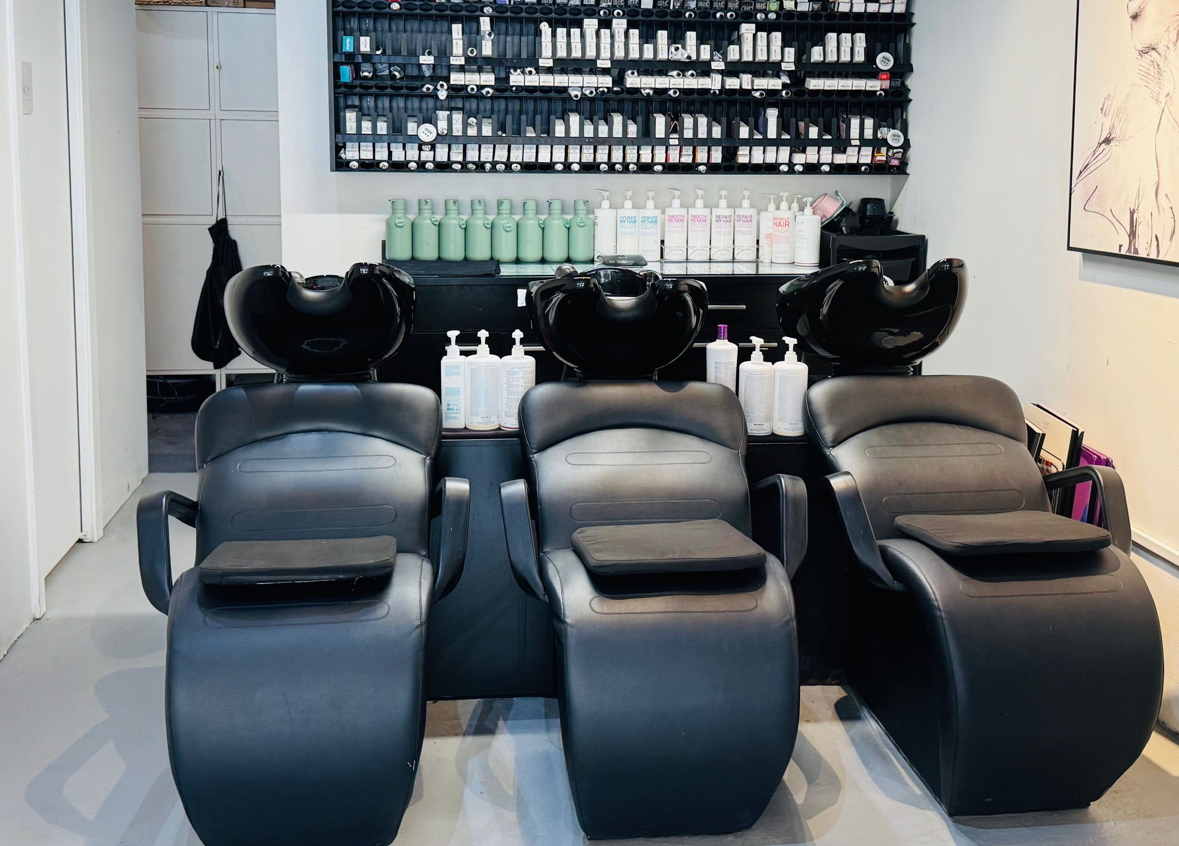 Modern wash stations at Hair by Sa in Surry Hills, New South Wales, AU, offering comfort and style.