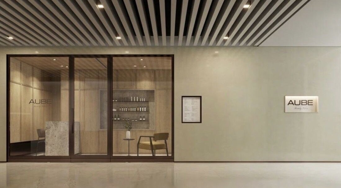 Entrance of AUBE Clarke Quay Central beauty salon, Singapore, SG with sleek interior design.