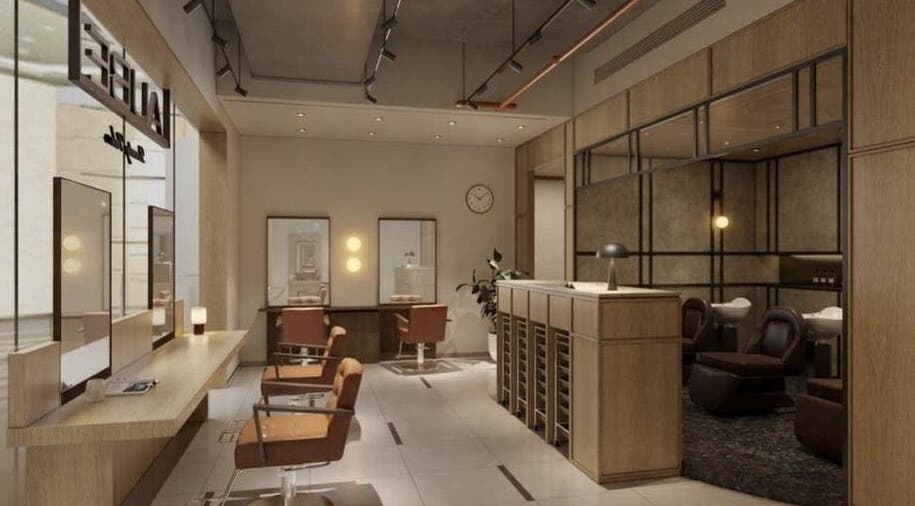 AUBE Clarke Quay Central in Singapore, SG, featuring a stylish, modern interior with elegant salon chairs and decor.