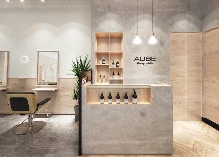 Elegant interior of AUBE Somerset salon in Singapore, SG featuring modern design and sleek fixtures.