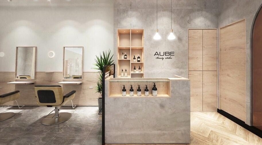 Elegant interior of AUBE Somerset salon in Singapore, SG featuring modern design and sleek fixtures.