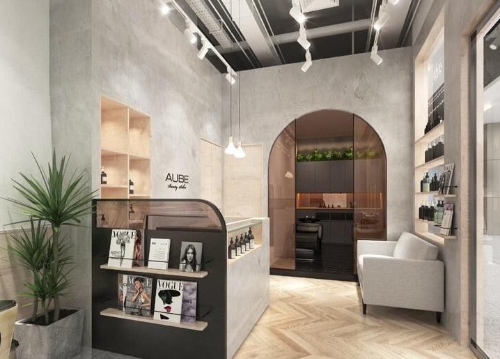 Reception at AUBE Somerset, a serene beauty venue in Singapore, SG with modern decor and cozy seating.