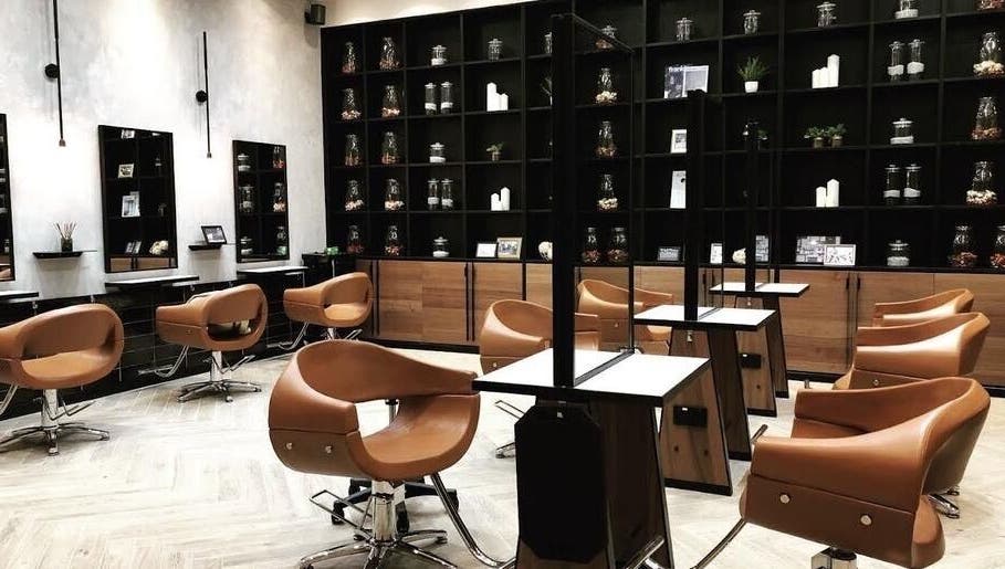 Modern salon interior at AUBE Marina Square, Singapore, SG, featuring sleek chairs and elegant decor.
