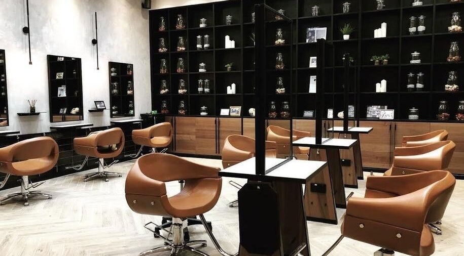 Modern salon interior at AUBE Marina Square, Singapore, SG, featuring sleek chairs and elegant decor.