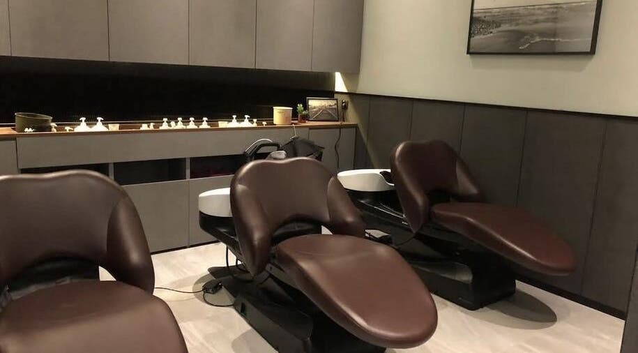 Elegant salon chairs at AUBE Marina Square, Singapore, SG, offering premium wellness services.
