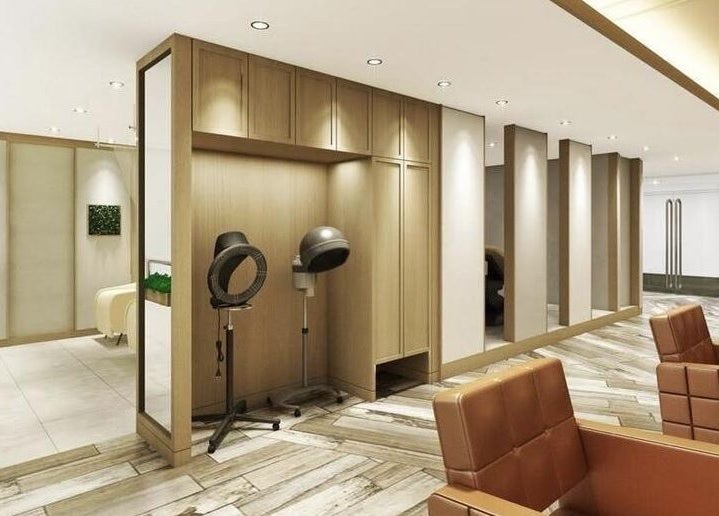 Modern salon interior at AUBE Wheelock Place, Singapore, SG, featuring sleek design and stylish seating.