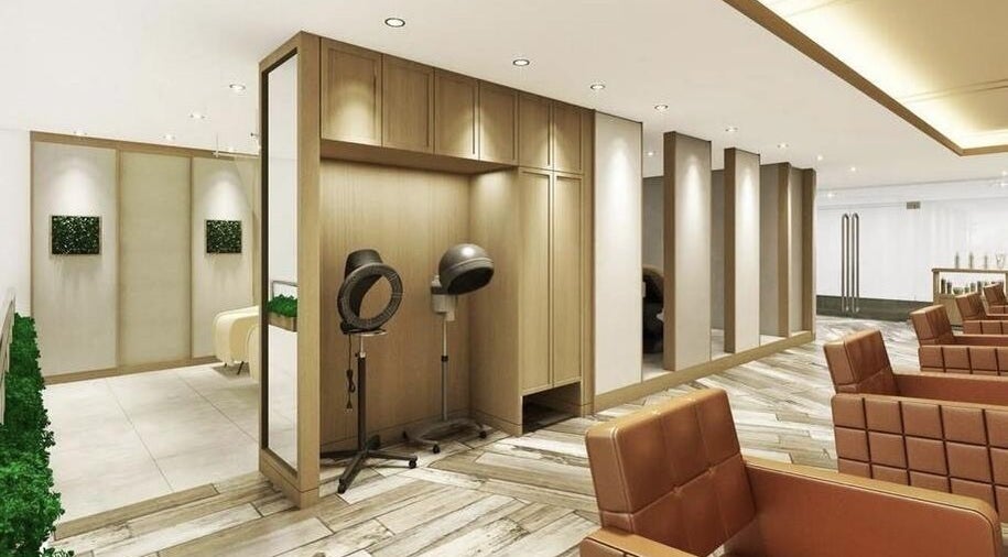 Modern salon interior at AUBE Wheelock Place, Singapore, SG, featuring sleek design and stylish seating.