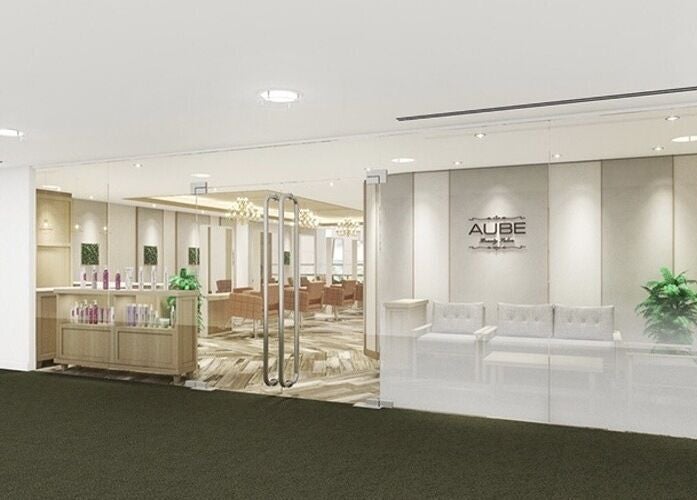 Modern interior of AUBE Wheelock Place beauty salon in Singapore, SG, featuring elegant seating and decor.