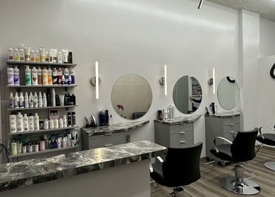 Modern salon setup at Big Boy Sales in New York, New York, US with styling chairs and product shelves.