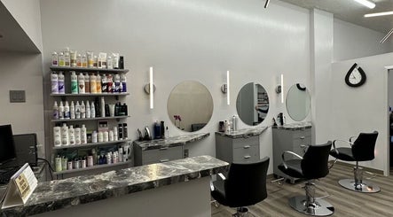 Modern salon setup at Big Boy Sales in New York, New York, US with styling chairs and product shelves.