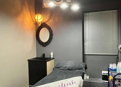 Cozy treatment room at Basiliah Beauty Salon Tan Can, Pretoria, Gauteng, ZA with ambient lighting decor.