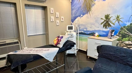 Relaxing treatment room at Basiliah Beauty Salon Tan Can, Pretoria, Gauteng, ZA with beach mural and wellness decor.