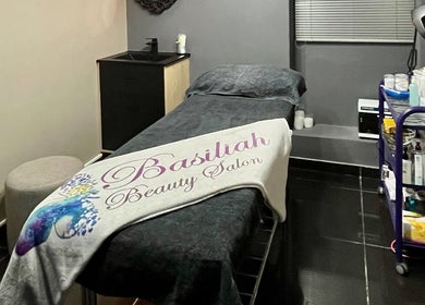 Cozy treatment room at Basiliah Beauty Salon Tan Can in Pretoria, Gauteng, ZA with a massage table and spa essentials.