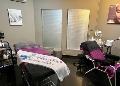 Relaxing treatment room at Basiliah Beauty Salon Tan Can in Pretoria, Gauteng, ZA, featuring modern amenities.