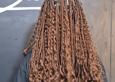 Stylish brown braids at Melbee Hair & Beauty salon, Thembisa, Gauteng, ZA, showcasing intricate hairstyle design.