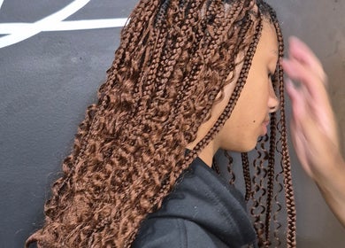 Intricate brown braids styled at Melbee Hair & Beauty salon, Thembisa, Gauteng, ZA.