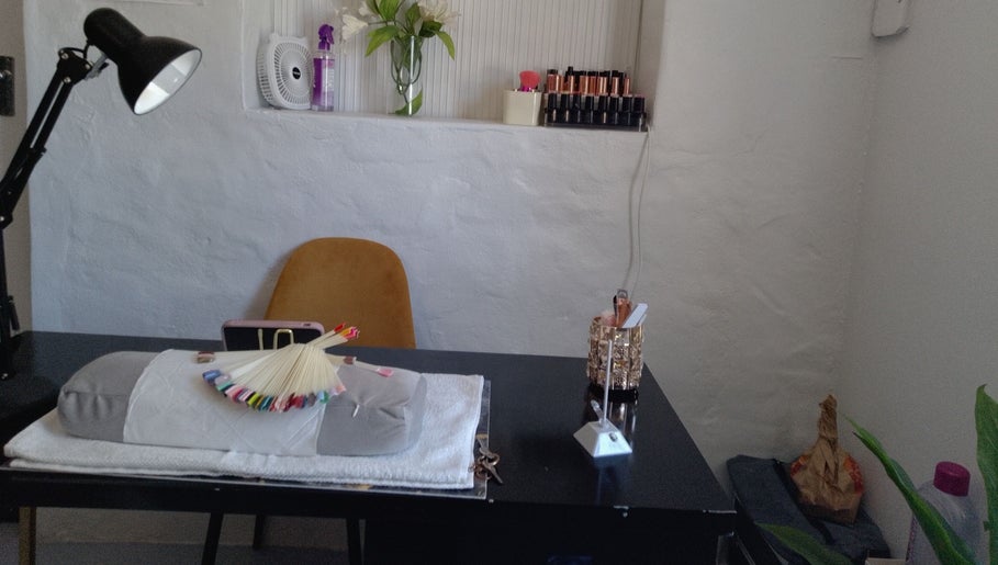 Cozy nail care corner at Twin Glam, Cape Town, Western Cape, ZA featuring stylish decor and tools.