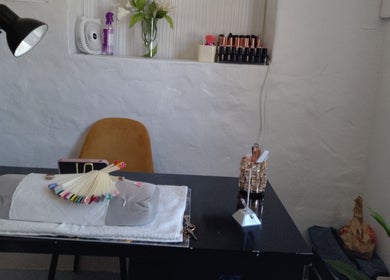 Cozy nail care corner at Twin Glam, Cape Town, Western Cape, ZA featuring stylish decor and tools.