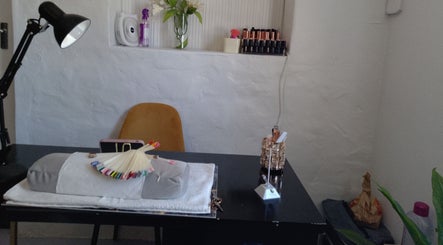 Cozy nail care corner at Twin Glam, Cape Town, Western Cape, ZA featuring stylish decor and tools.