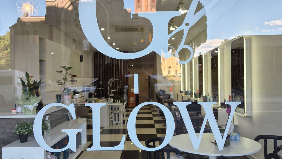 Elegant Glow Hair Lab entrance in Lidcombe, New South Wales, AU, showcasing stylish interiors and bright lights.