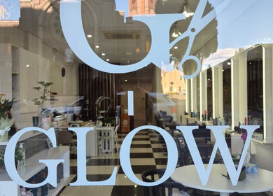 Elegant Glow Hair Lab entrance in Lidcombe, New South Wales, AU, showcasing stylish interiors and bright lights.