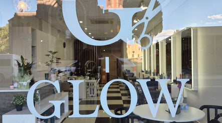Elegant Glow Hair Lab entrance in Lidcombe, New South Wales, AU, showcasing stylish interiors and bright lights.