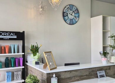 Reception desk at Glow Hair Lab, Lidcombe, New South Wales, AU adorned with L'Oréal products.