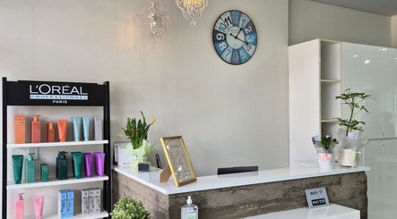 Reception desk at Glow Hair Lab, Lidcombe, New South Wales, AU adorned with L'Oréal products.
