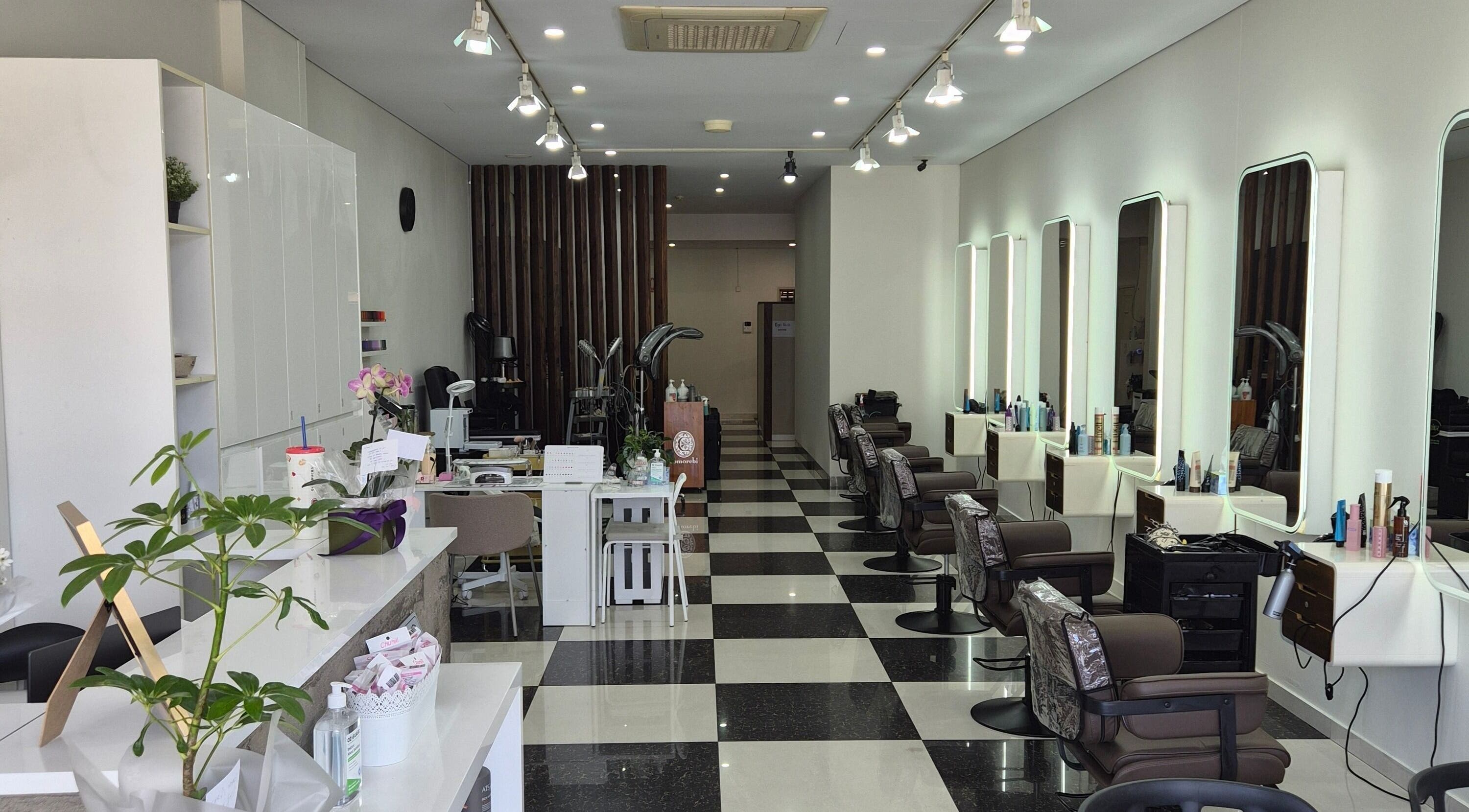 Bright, modern salon interior at Glow Hair Lab in Lidcombe, New South Wales, AU, featuring stylish stations.