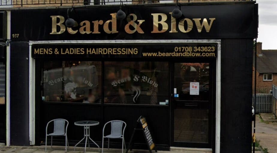 Exterior of Beard and Blow Hairdressing Salon in Romford, England, GB showcasing stylish signage.