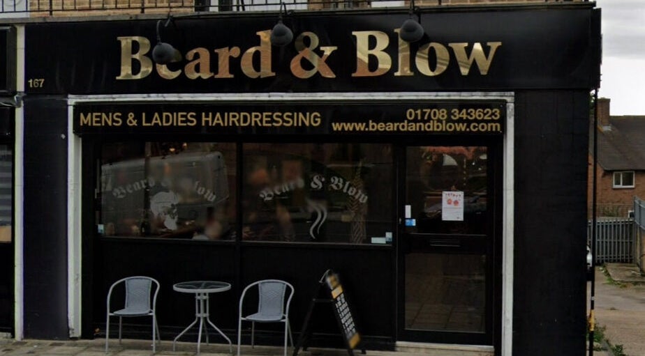 Exterior of Beard and Blow Hairdressing Salon in Romford, England, GB showcasing stylish signage.