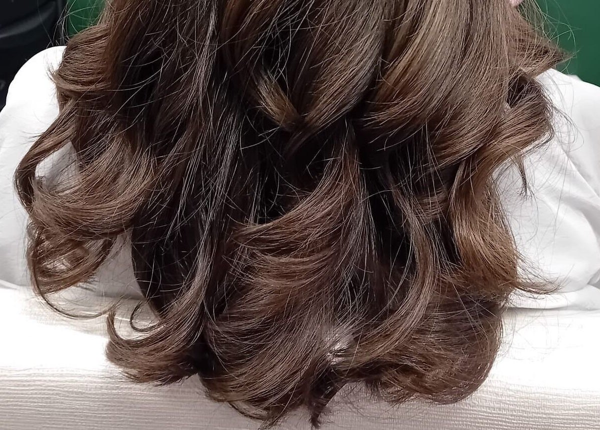 Elegant hairstyle at Beard and Blow Hairdressing Salon, Romford, England, GB.