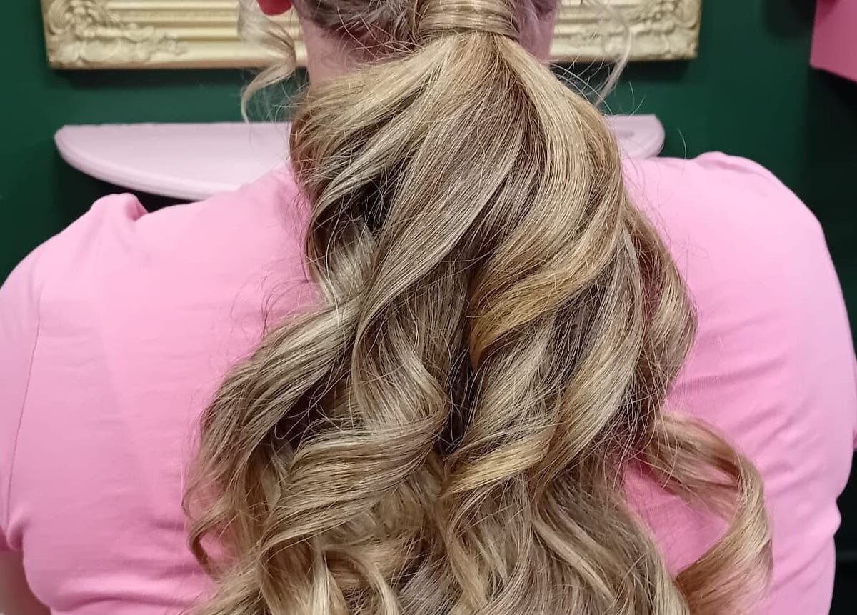 Elegant long ponytail hairstyle at Beard and Blow Hairdressing Salon in Romford, England, GB.