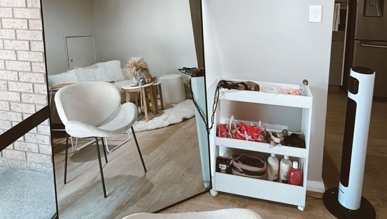Cozy beauty corner at Emma beauty, Carlton, New South Wales, AU. Modern chair and shelves with beauty essentials.