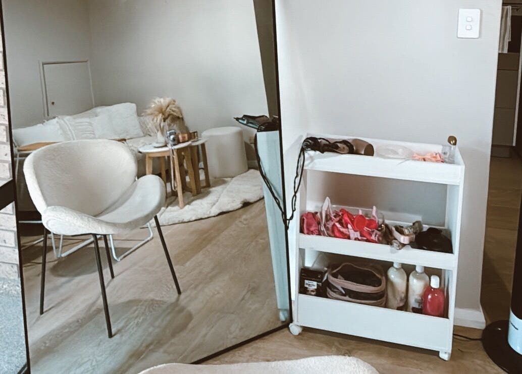 Cozy beauty corner at Emma beauty, Carlton, New South Wales, AU. Modern chair and shelves with beauty essentials.