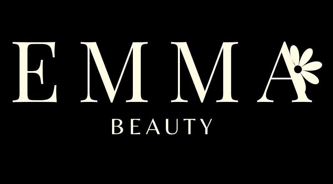 Emma Beauty logo in Carlton, New South Wales, AU. Stylish text with floral accent on a dark background.