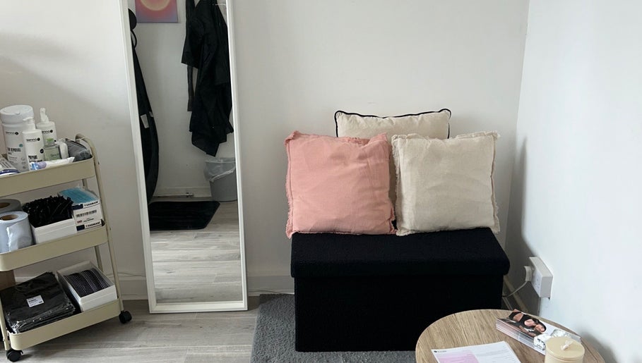 Comfortable seating and beauty products at Ell’s Glow Studio, Galley Common, England, GB.