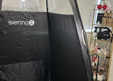 Sienna spray tanning booth at Ell’s Glow Studio in Galley Common, England, GB.