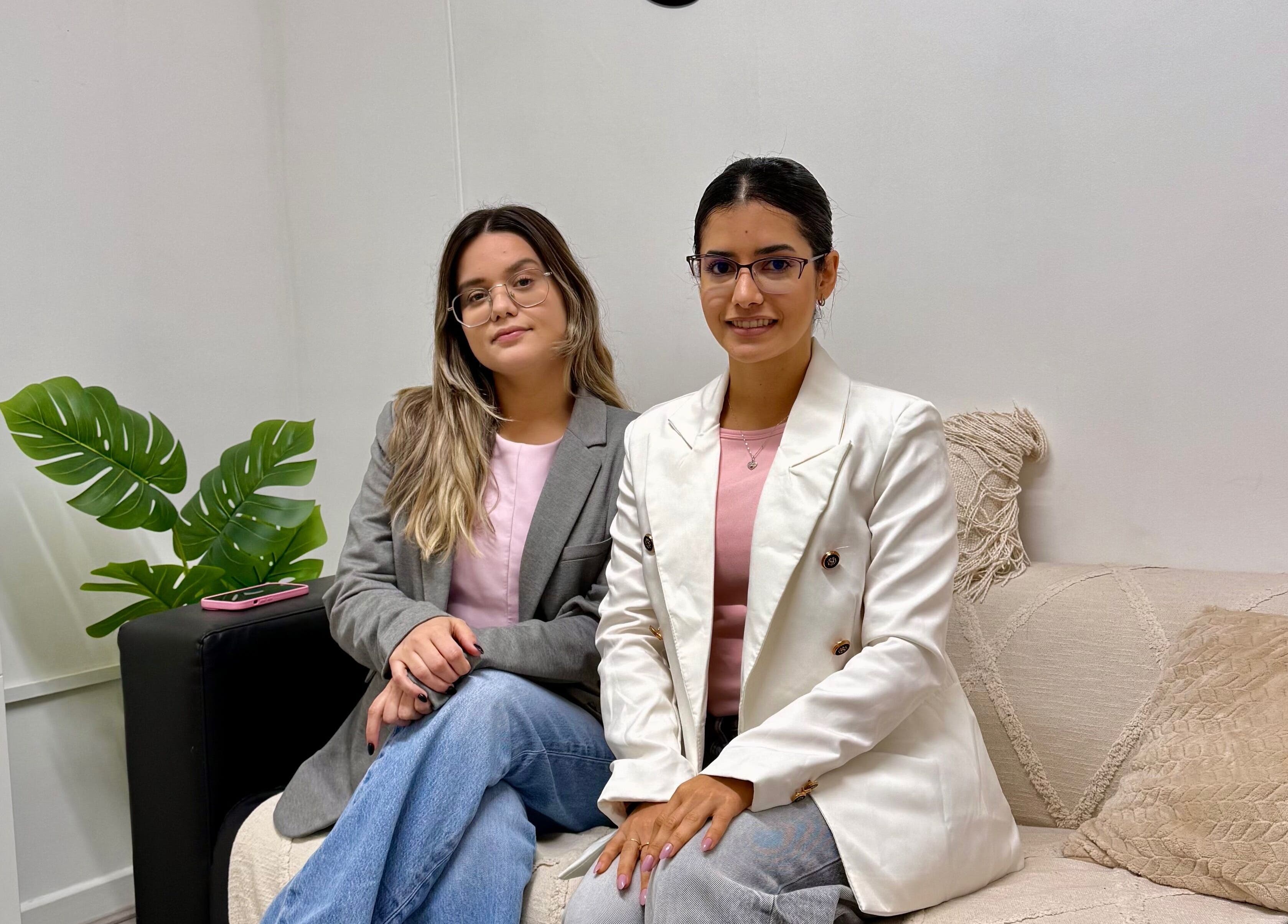 Two women seated in Duo Essence, Dublin, County Dublin, IE, showcasing elegant style and decor.