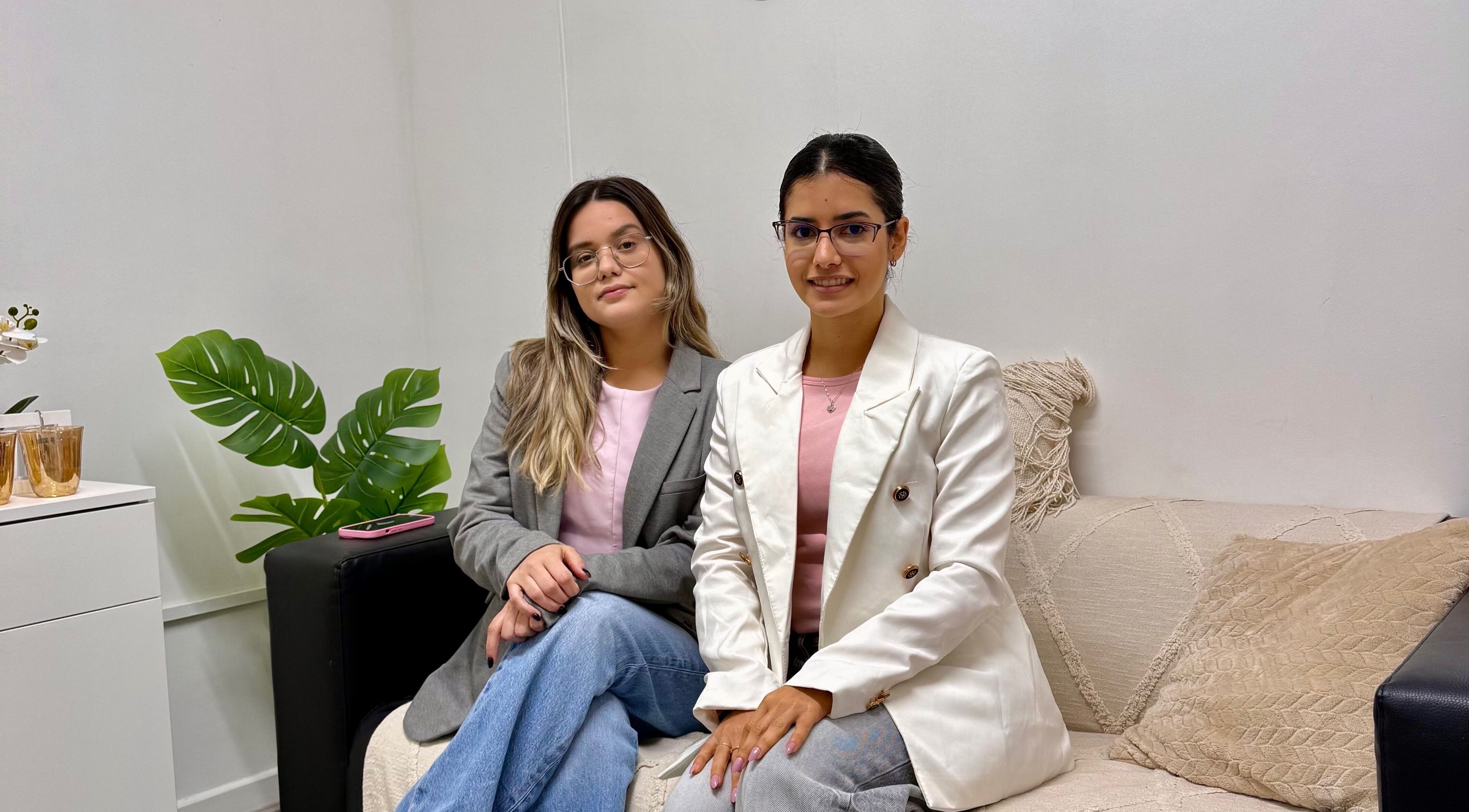 Two women seated in Duo Essence, Dublin, County Dublin, IE, showcasing elegant style and decor.