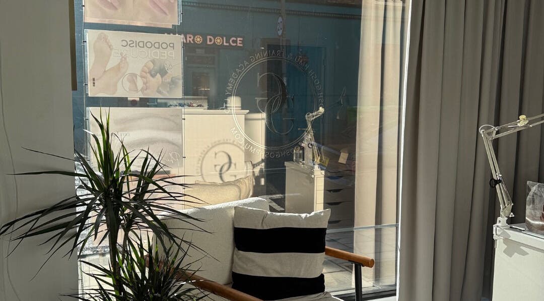 Interior of Gosh Gosh Clinic Battersea, London, England, GB with cozy seating near sunlight.