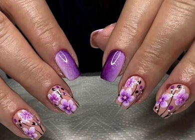 Elegant purple and floral nail art at BELIEER LUXEUESE, Pretoria, Gauteng, ZA. Stunning manicure design.