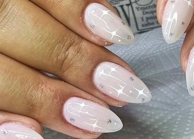 Elegant nail art design at BELIEER LUXEUESE in Pretoria, Gauteng, ZA. Featuring delicate white patterns.