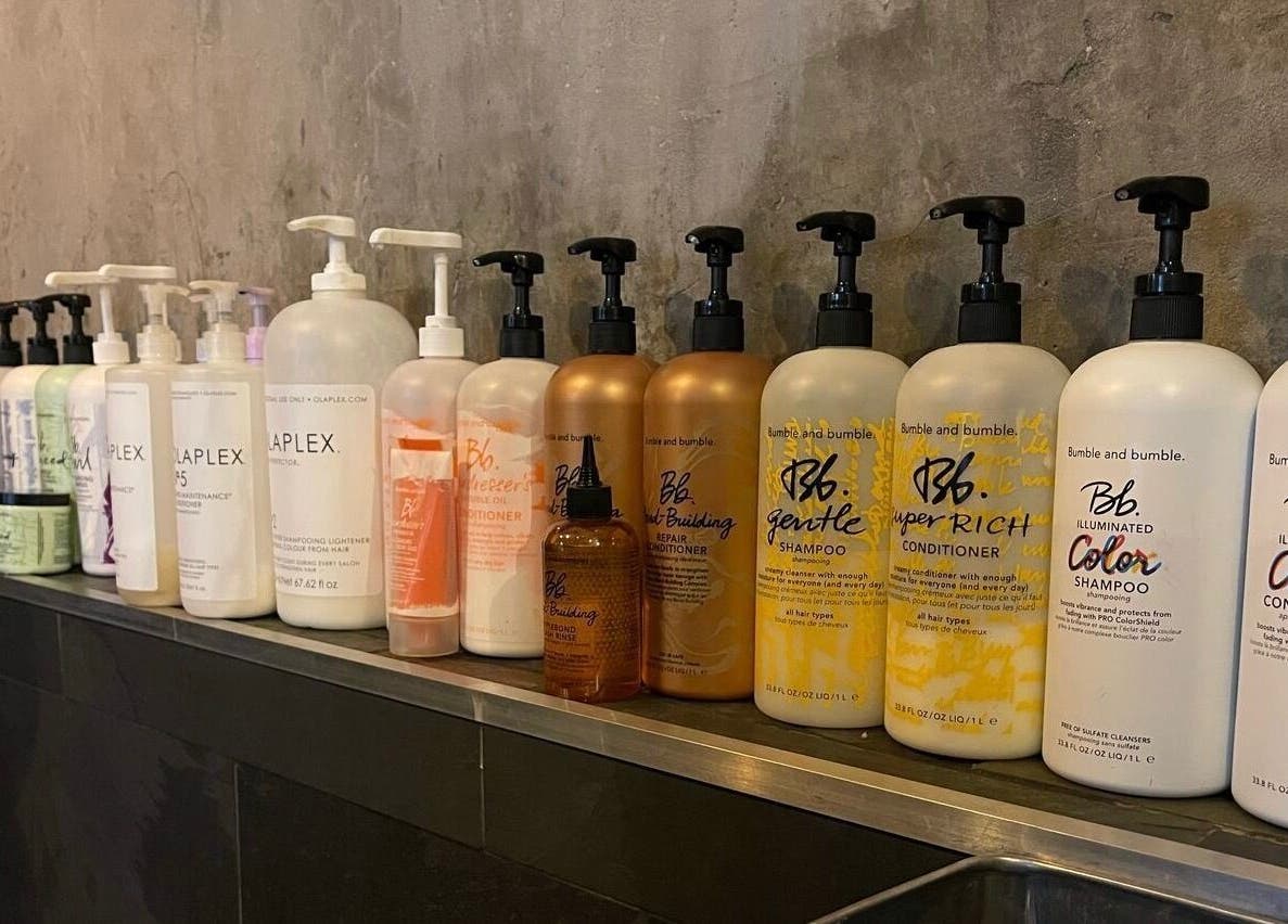Premium hair products on display at Transition Salon in London, England, GB, showcasing elegant design.