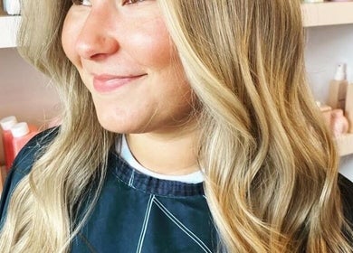 Woman with styled blonde waves at Beauty in Detail, Houston, Texas, US.
